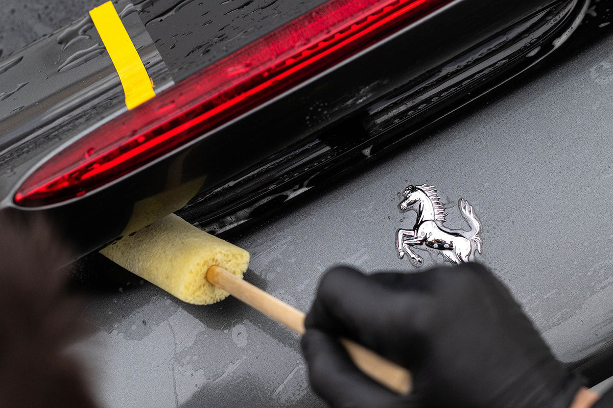 Cleaning between alloy wheel spokes with the Sponge Guru oval wheel detailer