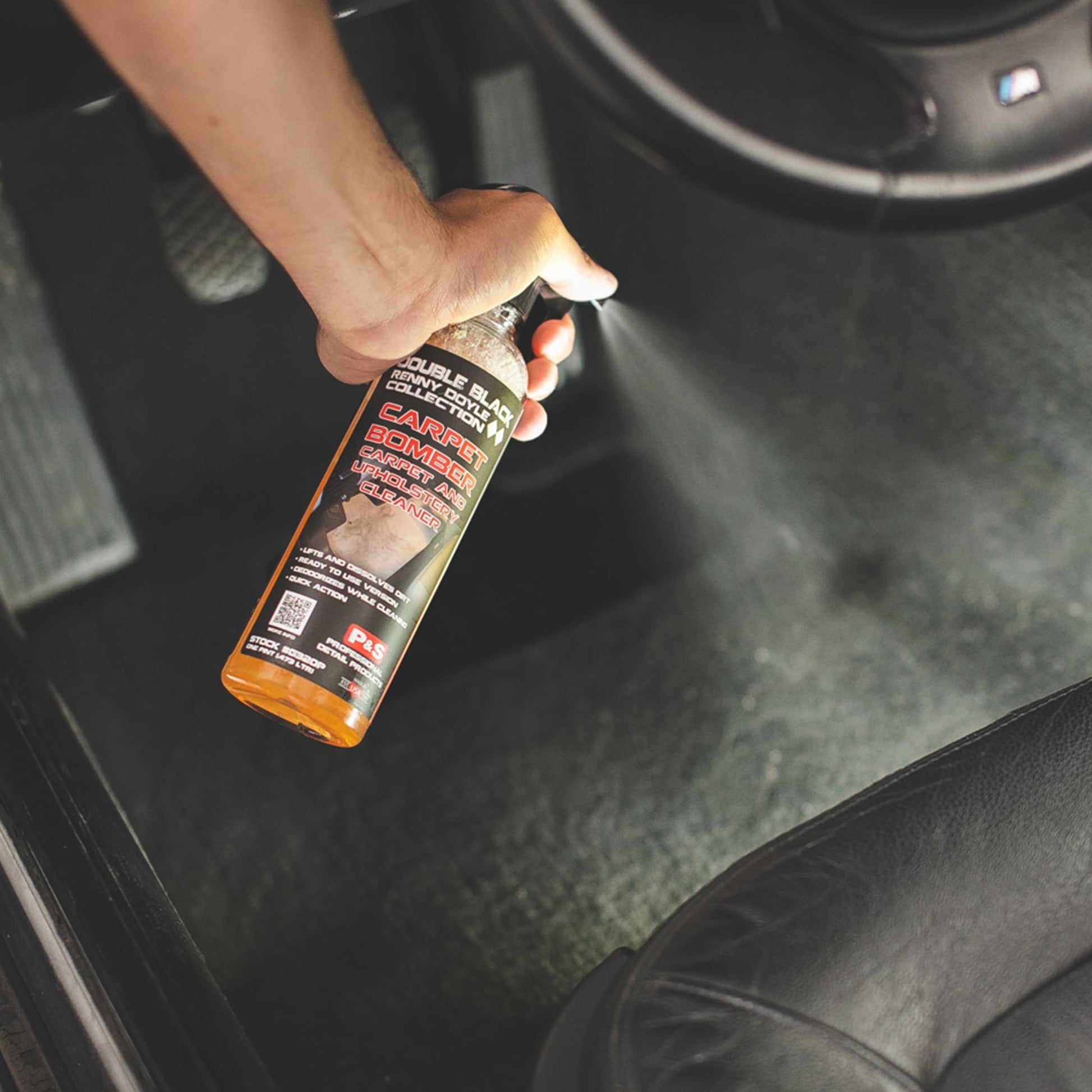 Detailer applying P&S Carpet Bomber to interior carpet