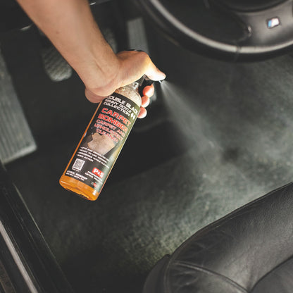 Detailer applying P&S Carpet Bomber to interior carpet
