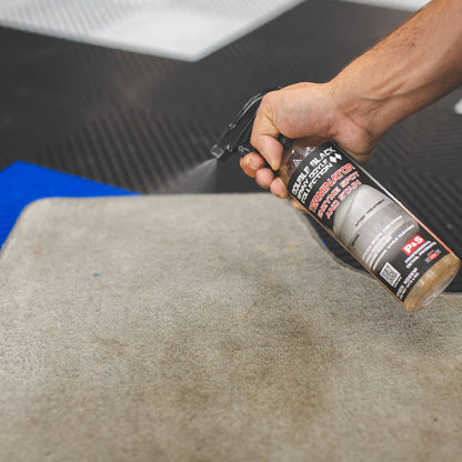 Terminator treating a stain on car carpet